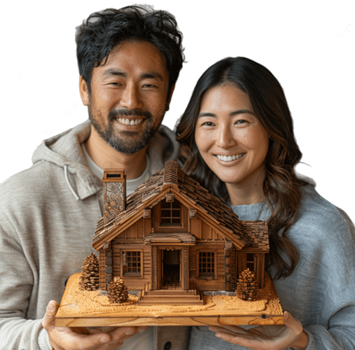 Image of a couple holding up a model of their home